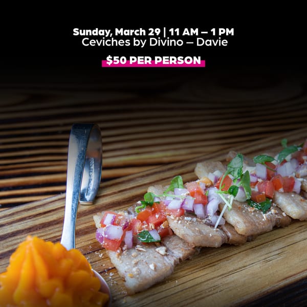 Peruvian ceviche with red onion, tomato, and cilantro on a wooden board, with a spoon of orange sauce.