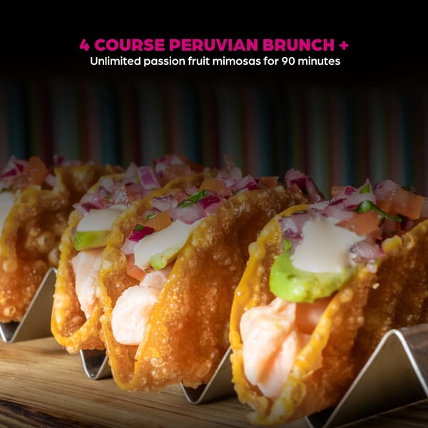 Peruvian shrimp tacos with avocado, red onion, and white sauce in crispy shells.